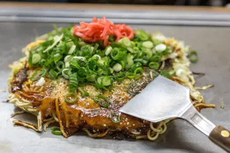 Traditional Japanese okonomiyaki, savory pancake
